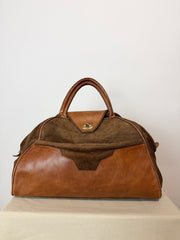 Borsa vintage in pelle e suede, fascino rétro dal carattere deciso