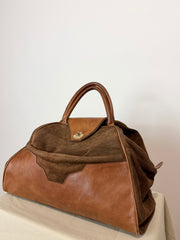 Borsa vintage in pelle e suede, fascino rétro dal carattere deciso